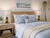Pair of small yellow pineapple ceramic lamps styled in a coastal teens bedroom