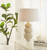 White sea urchin ceramic table lamp styled on an entry console in a light coastal foyer