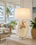Handmade Thai white ceramic crab table lamp displayed on a coastal lanai veranda