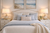 Handmade Thai white ceramic crab table lamp displayed in an upscale beach house bedroom