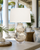 Handmade Thai cream and blue ceramic sea life table lamp displayed in a bright Hawaii coastal interior