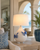Handmade Thai blue and white ceramic sea crab table lamp displayed in a bright coastal living room