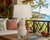 Handmade Thai white pineapple ceramic table lamp displayed on a Hawaiian veranda with tropical ocean views