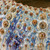 Close-up of ocean blue glaze, golden cream finish and raised sea urchin texture on Thai ceramic vase