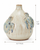 Cream and soft blue sea turtle ceramic vase measuring 8.5 inches wide by 9.5 inches tall
