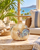 Handmade Thai sea crab ceramic vase displayed without flowers on a tropical lanai