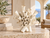 Sculptural white coral-inspired ceramic vase displayed in an elegant Mediterranean coastal setting