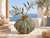 Green Moss handmade Thai ceramic vase styled with olive stems in a coastal interior