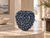 Sculptural indigo blue mushroom ceramic vase displayed on a travertine table in a luxury coastal interior
