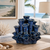 Handcrafted Thai ceramic coral flower vase featuring an organic coral-inspired design with sculpted sea flower openings. This decorative coastal vase measures 8 inches wide by 8.5 inches tall and serves as a beautiful tabletop accent for coastal, tropical, beach house, and resort-style interiors. Perfect displayed alone or styled with fresh flowers.