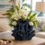 Handcrafted Thai ceramic coral flower vase featuring an organic coral-inspired design with sculpted sea flower openings. This decorative coastal vase measures 8 inches wide by 8.5 inches tall and serves as a beautiful tabletop accent for coastal, tropical, beach house, and resort-style interiors. Perfect displayed alone or styled with fresh flowers.