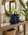 Handcrafted Thai ceramic coral flower vase featuring an organic coral-inspired design with sculpted sea flower openings. This decorative coastal vase measures 8 inches wide by 8.5 inches tall and serves as a beautiful tabletop accent for coastal, tropical, beach house, and resort-style interiors. Perfect displayed alone or styled with fresh flowers.