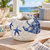 Sea life ceramic vase displayed without flowers in a bright coastal lanai setting