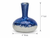 Royal blue and white ceramic vase measuring 4 inches wide by 4 inches deep by 5 inches high