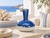 Royal blue and white Thai ceramic vase styled in a bright Mediterranean coastal interior