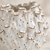 Close-up of handcrafted barnacle texture and glossy white glaze on Thai ceramic vase