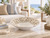 White barnacle ceramic bowl styled on a table in an upscale coastal living room