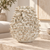 Handmade Thai white coral ceramic vase displayed without flowers to show the sculptural coral texture clearly