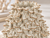Close-up detail of the handmade Thai white coral ceramic vase showing the dimensional texture and gold edge finish