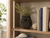 Handmade Thai celadon and sea blue ceramic vase displayed on a home office bookshelf
