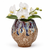 Handmade Thai sand dollar ceramic vase styled with a small white orchid