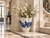 Medium handmade octopus vase styled in a refined coastal vignette with sea view and blue and white décor accents.