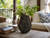 Handmade Thai taupe and sea blue coral ceramic vase in a coastal lanai setting with tropical greenery