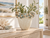 Oyster white and blue ceramic floral vase displayed in a bright coastal interior