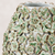Close-up of sculpted floral relief and green reactive glaze on handmade Thai ceramic vase