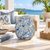 Light blue ceramic floral vase styled with white blooms in an elegant coastal setting