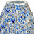 Close-up of sculpted floral detail on the light blue handmade ceramic vase