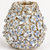 Close-up of sculpted floral relief, cream glaze, and subtle blue accents on handmade Thai ceramic vase