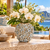 Small blue and cream Bouquet De Fleurs ceramic vase styled with white orchids in an elegant coastal setting