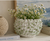 Handmade vase with beautiful with wildflowers orchids