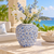 Medium light blue Bouquet De Fleurs ceramic vase styled with delicate stems in a bright coastal setting