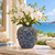 Medium deep blue Bouquet De Fleurs ceramic vase styled with white orchids in an elegant coastal setting
