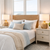 Pair of white handwoven abaca rope table lamps L150 styled on bedside tables in a coastal bedroom.