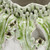Close-up of leaf green and ivory Ocean Bloom ceramic vase showing hand-applied coral-inspired texture and glaze details