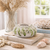 Handmade Thai Ocean Bloom ceramic vase styled in a bright coastal interior with neutral furnishings