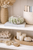 Leaf green Ocean Bloom ceramic vase displayed on an upscale neutral shelf with coastal decorative accessories