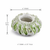 Ocean Bloom ceramic vase in leaf green and ivory with dimensions 4 inches wide by 2.75 inches tall