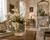 Handmade Thai cream floral ceramic vase with pale orchids and delicate wildflowers displayed in an elegant French-style home with classic European décor.