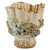 Side view of large aqua and cream octopus ceramic vase showing dimensional marine-life texture.