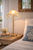 Capiz Shell Dome Table Lamp L111S illuminated on an accent table in an elegant coastal room.