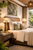 Capiz Shell Dome Table Lamp L112L styled on a bedside table in an elegant coastal bedroom with warm ambient lighting.