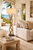 Island Knot Manila rope floor lamp FL131 styled beside coastal seating with the sculptural knotted base fully visible.