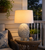 Blue Jasmine Bloom Ceramic Table Lamp styled on a side table in an elegant coastal living room.