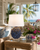 Handmade Thai blue oyster ceramic table lamp styled in a coastal room with floral accents
