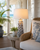 Handmade Thai white and blue coral ceramic table lamp styled beside seating in a bright tropical coastal room