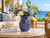 Azure Reef blue octopus ceramic vase with white and blue flowers in a bright oceanfront coastal room.